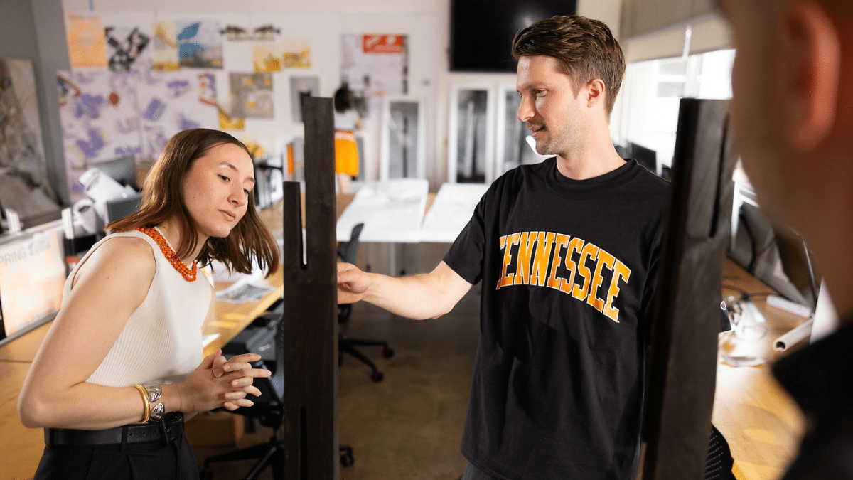 A student and a professor in a lab.