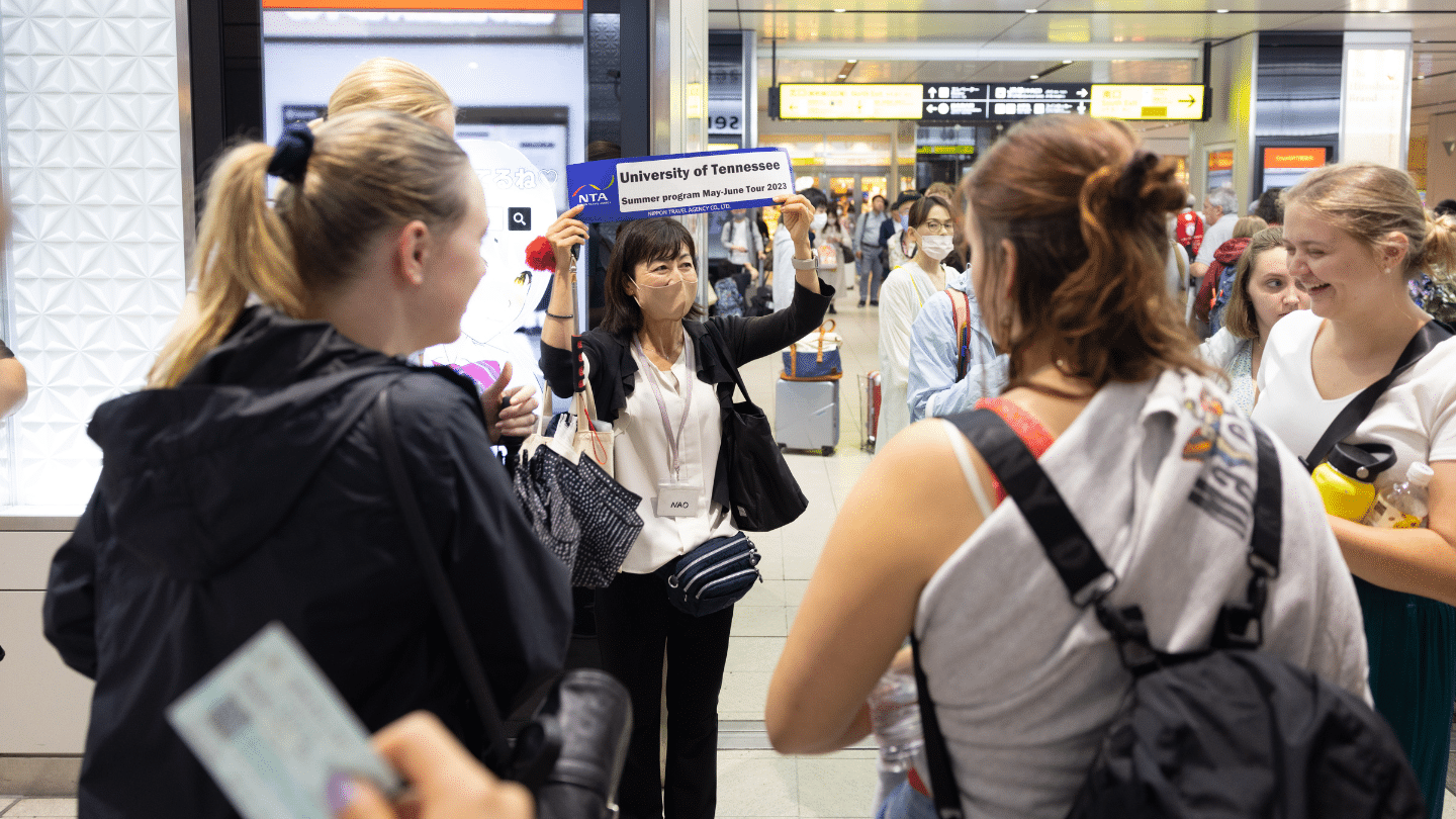 A guide meets students of the Howard Baker Center Japan Ambassadors Program study abroad trip at the Hiroshima train station after a ride on the bullet train on June 02, 2023.
