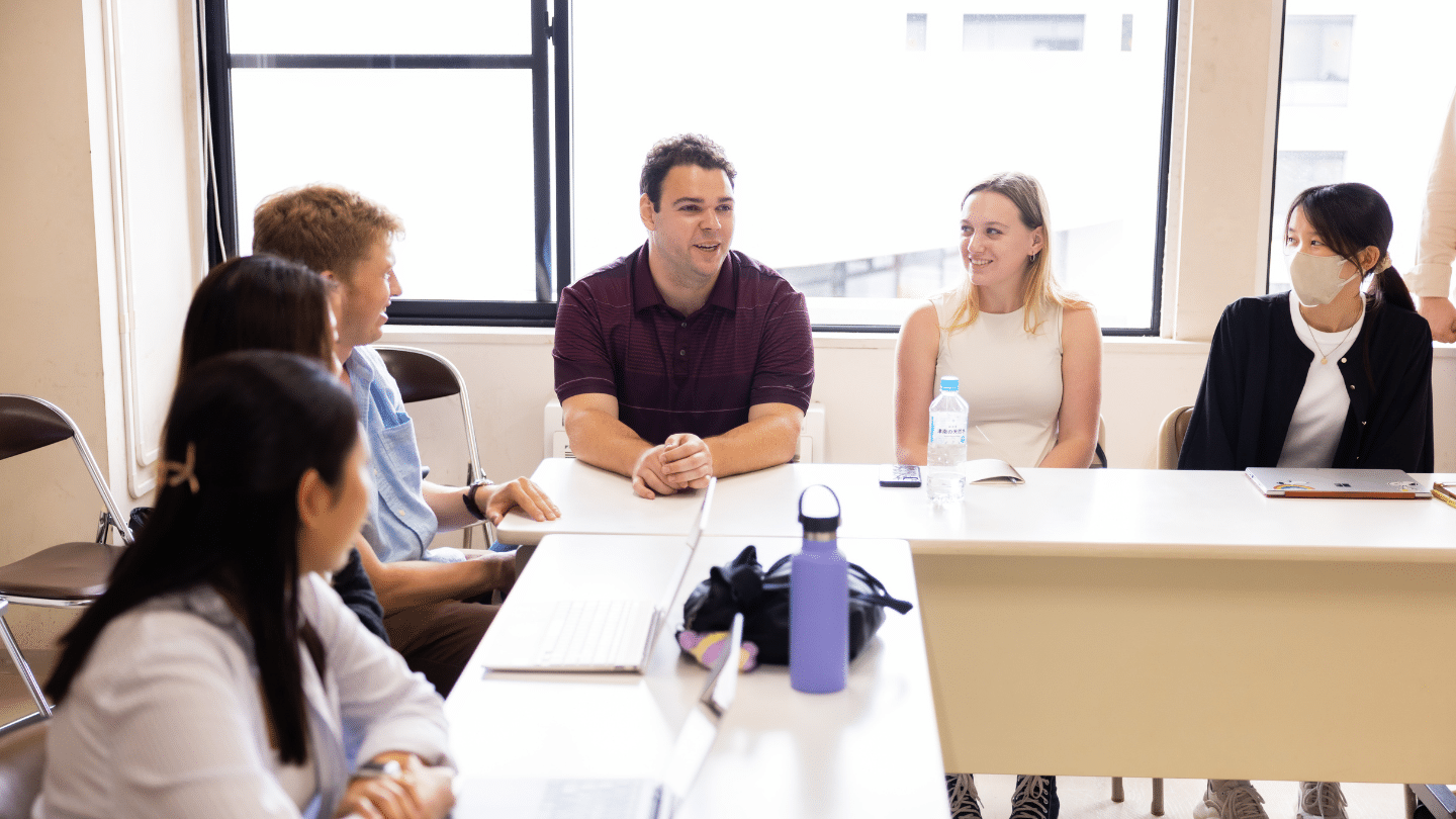 Jack Duncan, Noah Mcgill and Tyler Staszewski, with the Howard Baker Center Japan Ambassadors Program, participates in an international relations class with graduate students